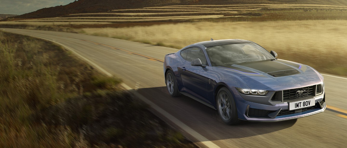 Blue Mustang driving on the open road
