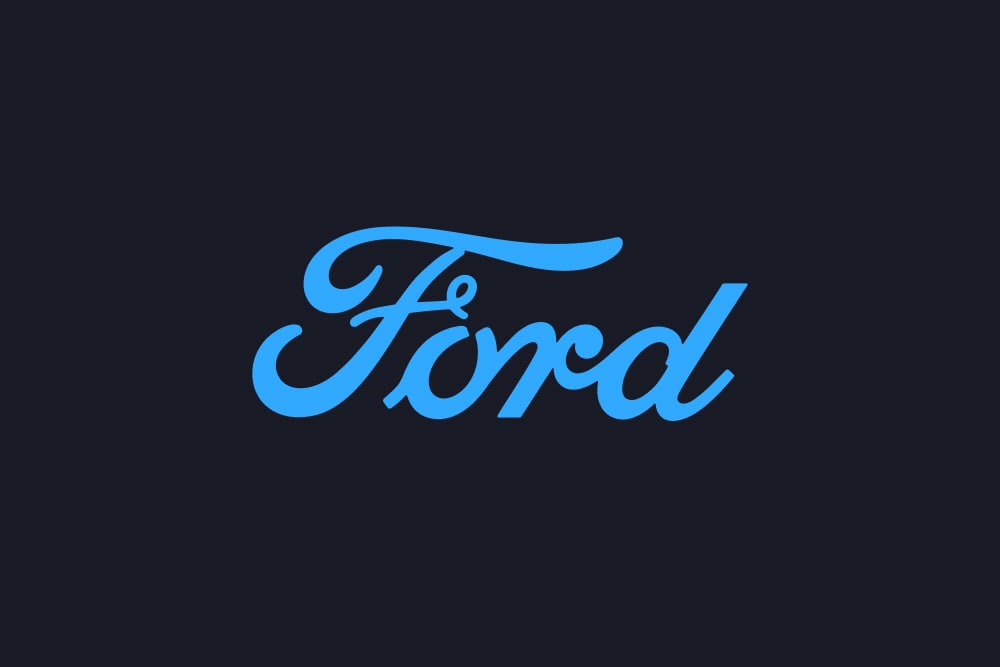 Logo bleu de la marque Ford sur fond sombre.