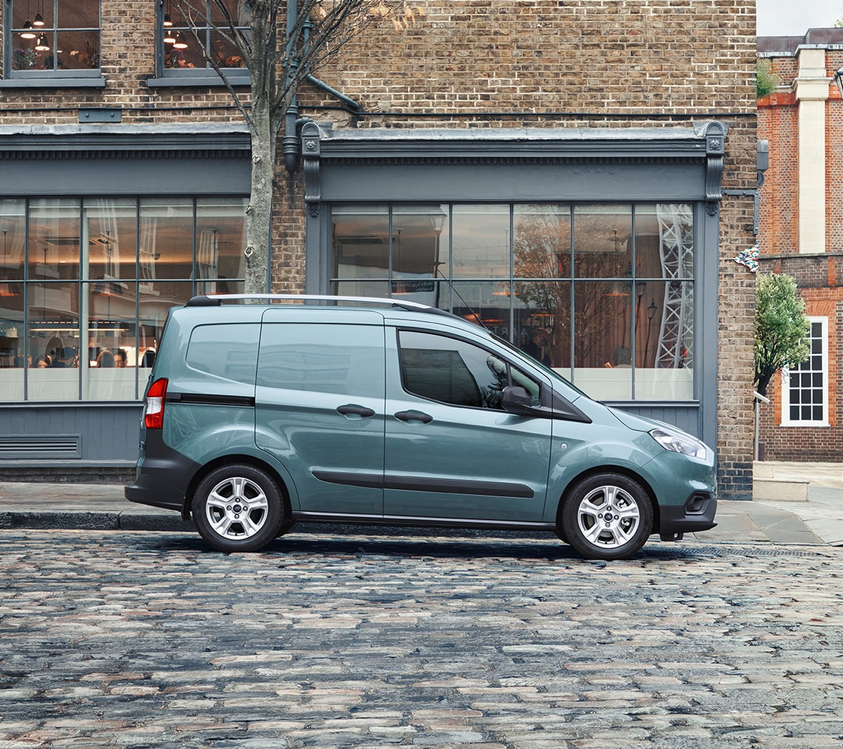 New Ford Transit Courier parked on cobbled street