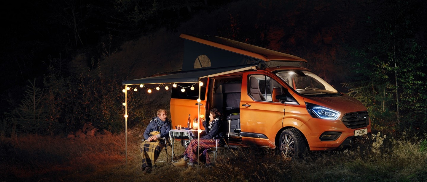 Ford Transit Custom Nugget with couple camping