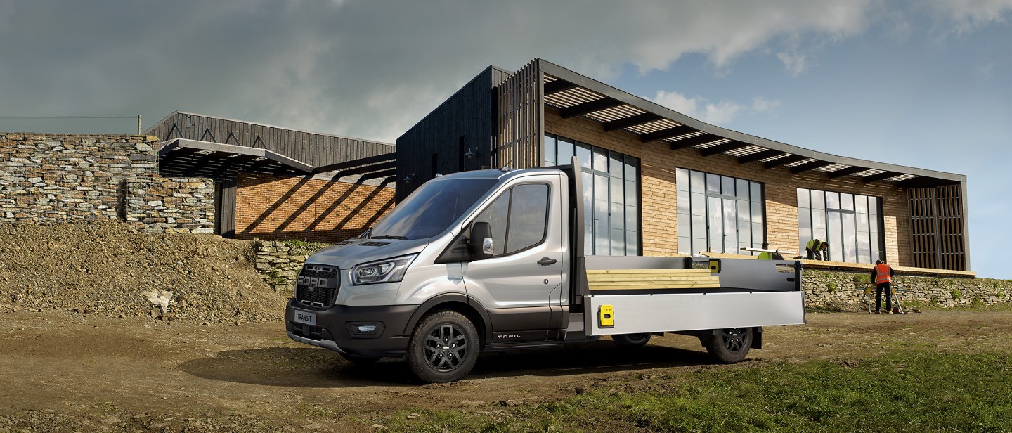 Ford Transit Chassis Cab standing in front of modern house frontal view