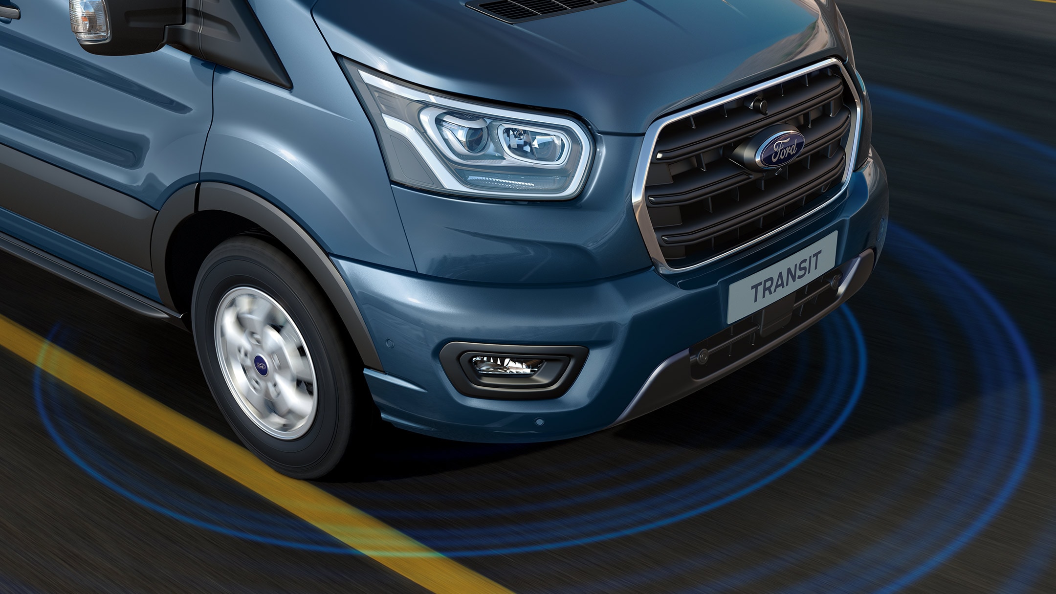 Ford Transit couleur bleue, vue de face aux trois quarts, illustration de l’alerte de franchissement de ligne