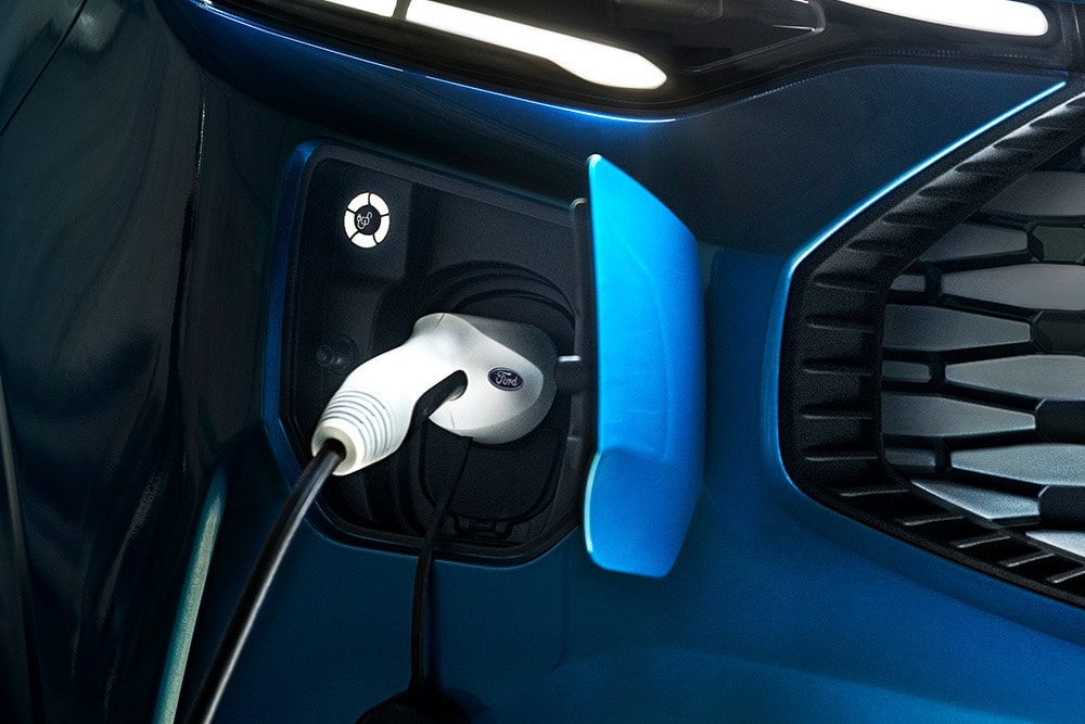 Charging port of blue Ford E-Transit Custom electric van.