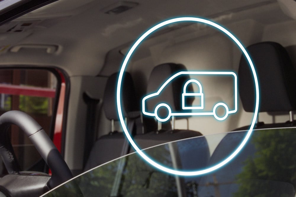 Symbole d'un fourgon verrouillé sur le pare-brise d'un Ford E-Transit Custom.